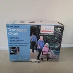 Walgreens Ultra Light Transport Chair Ref. # WRX449723, Storage Bag, Seat Belt. Open. Price: $48.98.